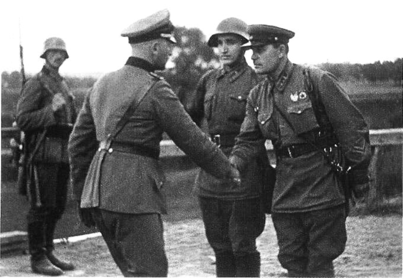 A German and a Soviet officer shaking hands at the end of the Invasion of Poland. Unknown war correspondent of TASS press agency , October 1939 / Wikipedia